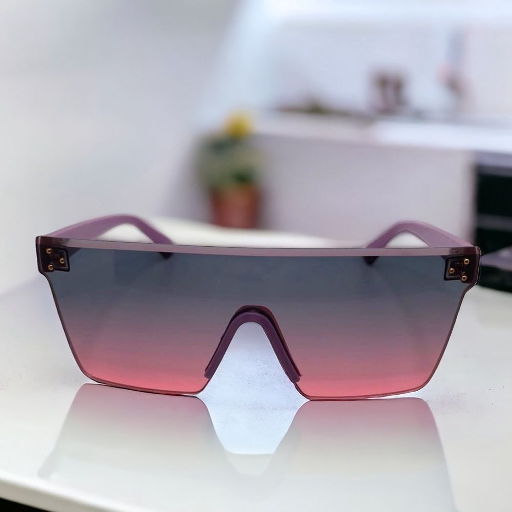 Oversized square rimless shield sunglasses with blue to pink ombré tint.